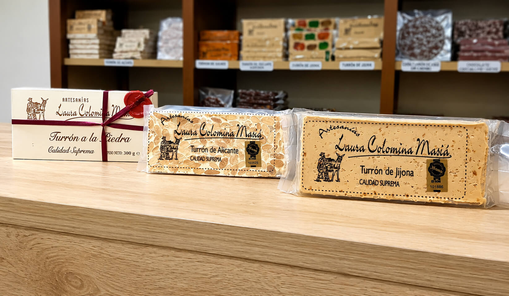 Packaged turrón de Jijona and turrón de Alicante from Laura Colomina Masiá, on their shop counter in Jijona